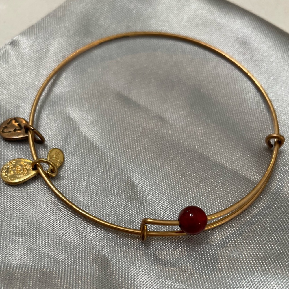 Alex and Ani Bracelets. 5 bracelets: 4 Gold, 1 Silver.